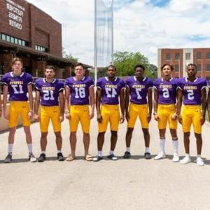 Members of the HSU football team pose for a photo.